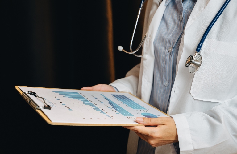 doctor reviewing medical paperwork